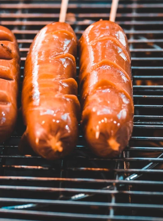 hot dogs on the grill